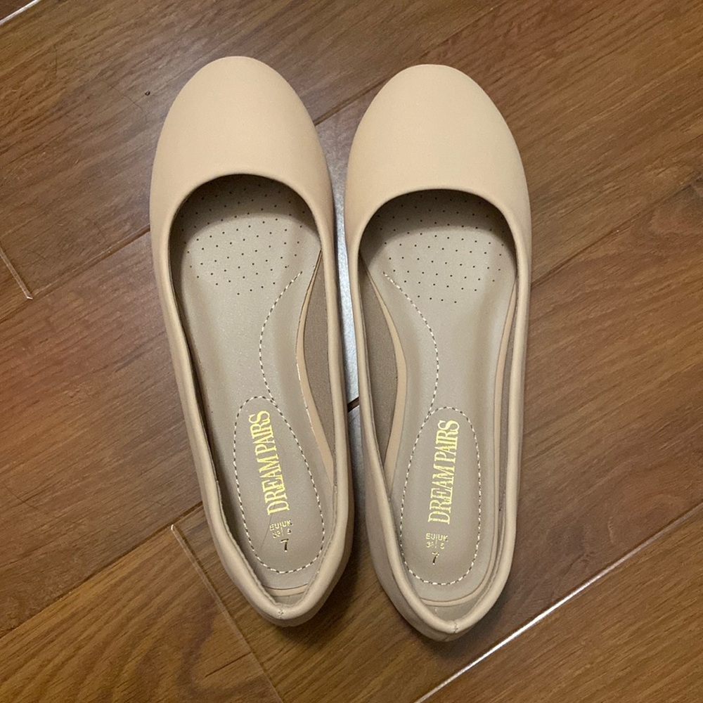 Nude colored flats. Size 7. Still have the box and bag for the pair